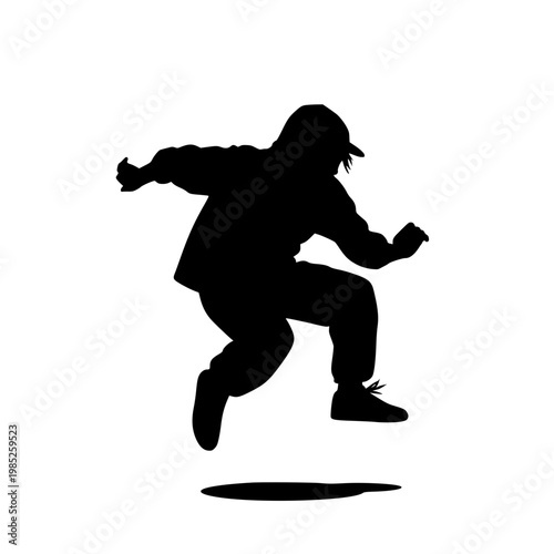 Silhouette of a Hip Hop Dancer Jumping in Mid-Air