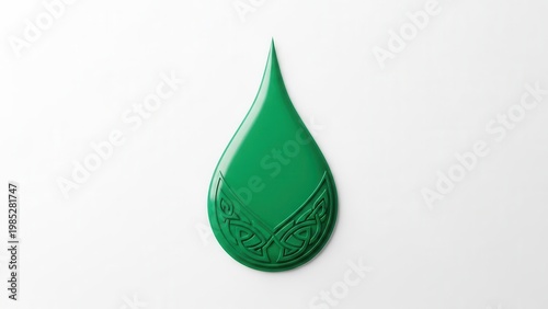 Vibrant green fluid droplet featuring an ornate embossed Celtic knot design on a clean white