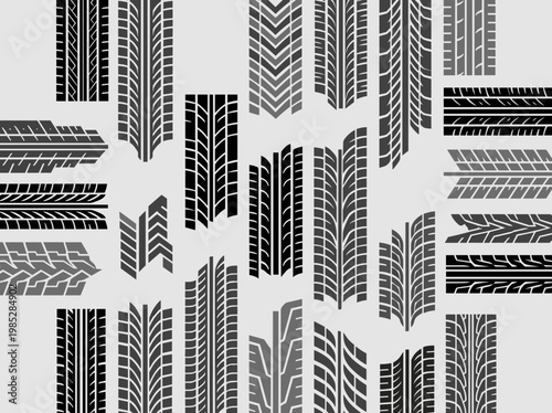 Tire tread patterns in black and grey arranged on a light background  