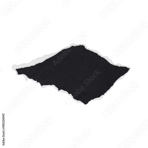 фотографія Torn black paper piece isolated on a white background with ragged edges, a blank textured design element