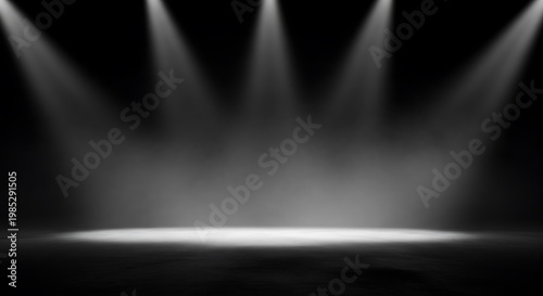 Stage illuminated by multiple spotlights creating a bright central area on a dark background