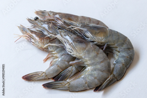 Photos fresh black tiger shrimps isolated on white background, view from above