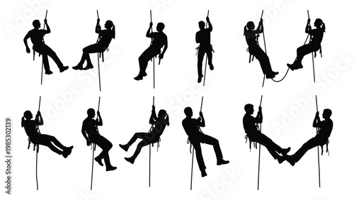 Silhouettes of people rappelling down a cliff face illustrating adventure and outdoor activity high quality professional