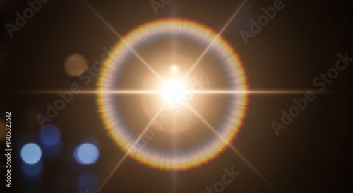 Lens flare illuminates a dark background with scattered bokeh lights.