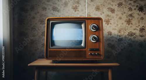 Retro television set from the 1970s with a vintage screen display on a wooden table, evoking nostalgia and classic entertainment