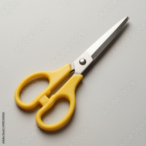Yellow-Handled Scissors on Neutral Gray Background