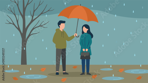 Man holds umbrella over woman during a rainy autumn day