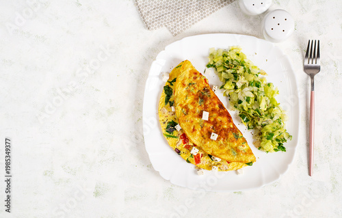 Healthy Omelette with Fresh Salad on White Plate Top View