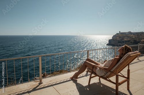 Vacation concept with chair positioned toward ocean view capturing peaceful coastal lifestyle and open horizon