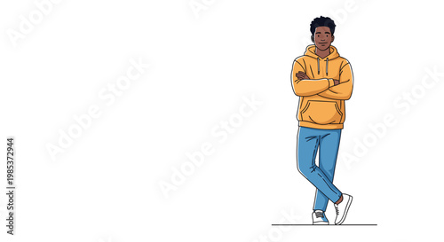 Cool young Black man in a yellow hoodie and blue jeans standing with arms crossed against a plain white background.