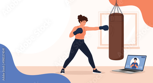 Athletic woman practicing her boxing technique with a punching bag while watching an online trainer on a laptop.