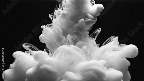 White Ink Cloud Underwater on Black Background