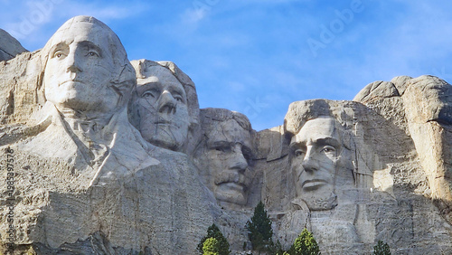 Mount Rushmore National Memorial with four US presidents at golden hour, South Dakota, USA