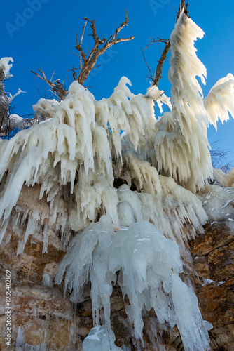 Large icicles hang from the steep cliffs.