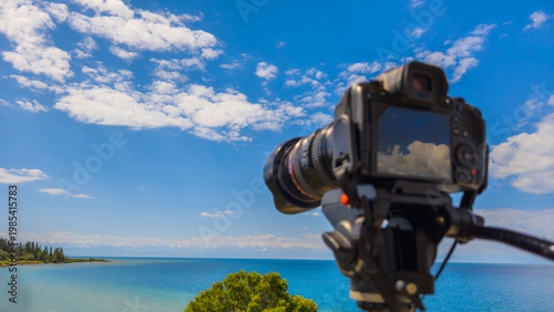 Camera on tripod capturing serene landscape in Kyrgyzstan