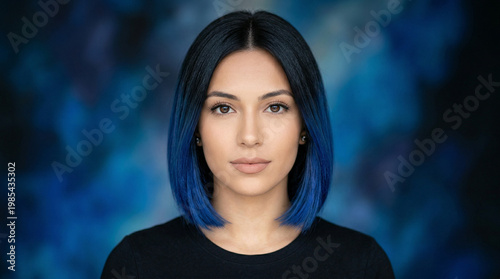 Portrait of a young woman with black and blue hair