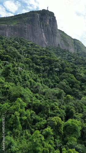 Aerial view of Corcovado mountain with Christ the Redeemer statue and Atlantic Forest in Rio de Janeiro, Brazil