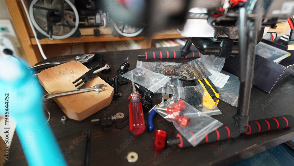 Fototapeta premium Drone Repair Workshop Table with Tools and Spare Parts