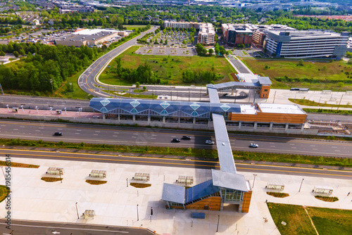 Drone view of a Virginia subway station. Parking and bus stops nearby.