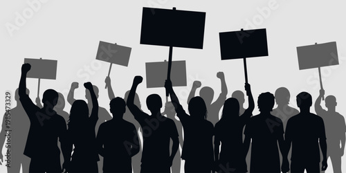 Protesters hold signs in a demonstration downtown during the evening.