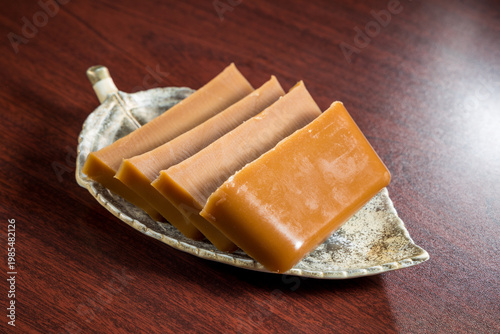 Slices of brown sugar jelly dessert on plate