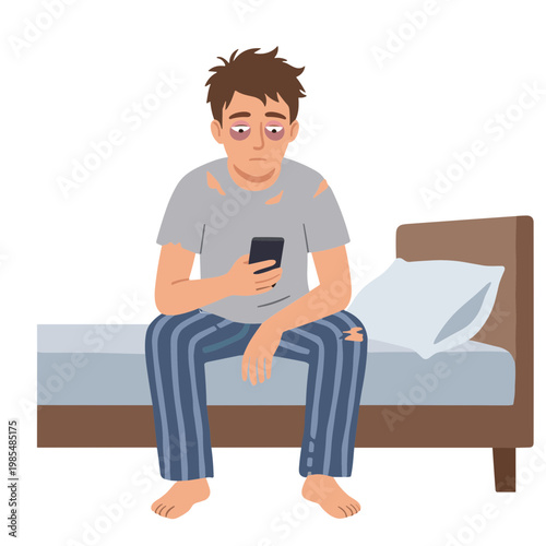 A man sits on bed looking tired and bored with his phone