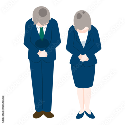 Businessman and businesswoman bowing deeply in apology