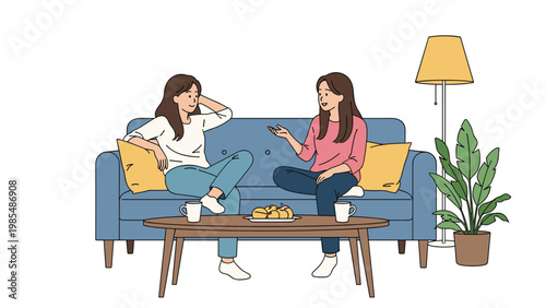 Two female friends enjoy a casual conversation while sitting on a comfortable blue sofa with coffee and snacks.