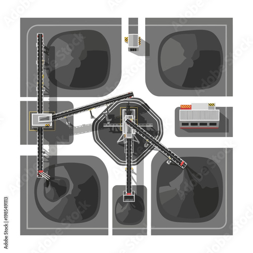 Top view of industrial coal storage and loading facility with conveyor belts and silos.