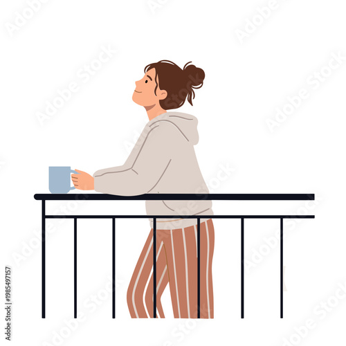 Woman stands by railing with a cup looking outside in casual clothes
