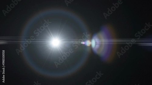 Elegant lens flare on black backdrop concept. Bright glowing lens flare with colorful light effects on dark background for photography and design