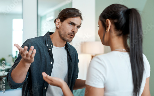Photos Argument, tension and couple in living room with fight, conflict or frustration in toxic relationship