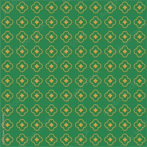 Seamless geometric pattern with yellow clover shapes on green background