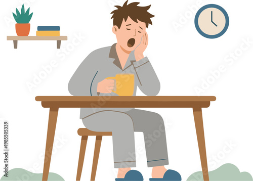 Man yawns while sitting at a wooden desk in pajamas with a book