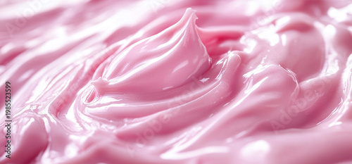 Close-up texture of pink cosmetic cream or body lotion. Smooth, wavy swirl of moisturizing product. Beauty and skincare background for advertising, professional cosmetic treatment concept