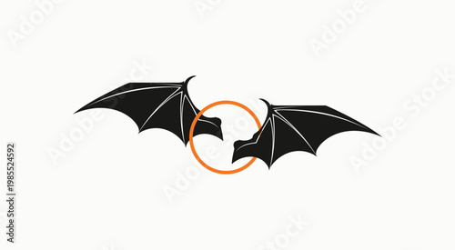 Black bat wings silhouette framing an orange circle on a white background for halloween.