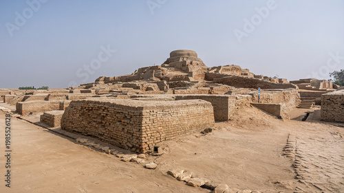 Scenic landscape view of citadel mound with buddhist stupa in archaeological ruins of UNESCO World Heritage Mohenjo Daro, Larkana, Sindh, Pakistan