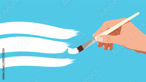 Human hand holds a paintbrush while applying thick white paint strokes onto a bright blue background for art projects.