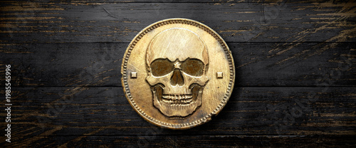 Golden pirate treasure vintage skull coin on grungy, black wooden background
