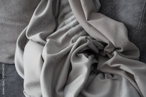 Blackout curtain with loops designed for easy hanging on a curtain rod. Features a textured surface and sturdy construction, ideal for blocking light and ensuring privacy in living spaces.