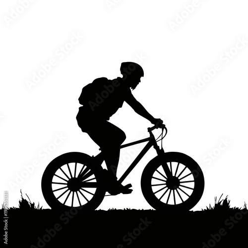 silhouette of a cyclist riding a mountain bike