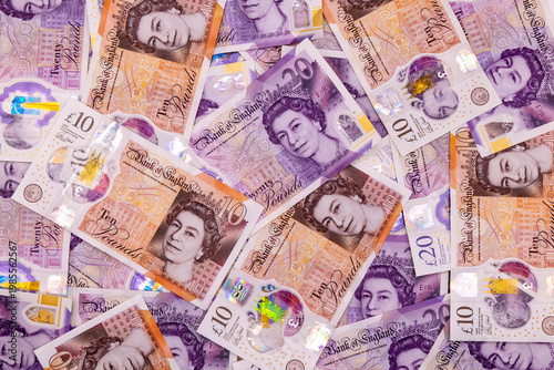 A background with many 20 and 10 pound banknotes, british currency, Elizabeth II