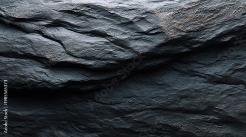 Textured Dark Stone Surface with Natural Patterns Ideal for Backgrounds and Design Elements in Various Creative Projects