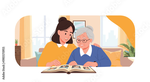 Elderly grandmother and her granddaughter sitting together on a sofa looking through a photo album and sharing memories in a cozy room.