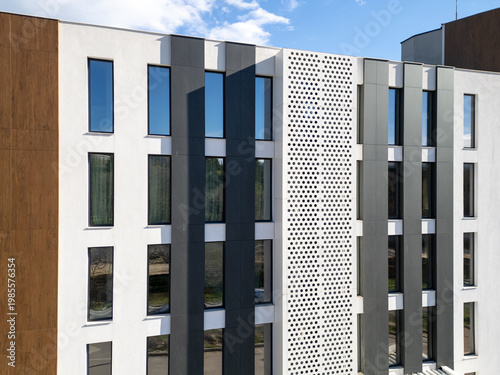 Aerial tilt up of modern residential building facade with windows and balconies