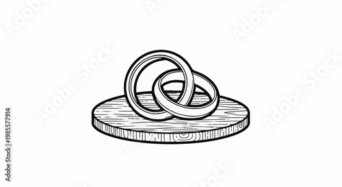 Two linked rings resting on a wood slice with wood grain detail