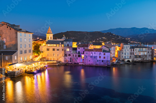 Saint Florent Corsica at blue hour, harbor waterfront village with colorful lights reflections, Corsica France coastal town night landscape