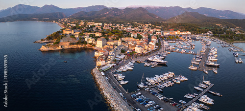 Saint-Florent Marina and Old Town at Sunset, Corsica Island, France – Aerial Coastal Landscape