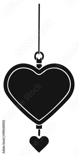 Black silhouette of a heart locket pendant with a small hanging charm symbol of love romance and affection