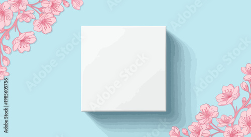 Elegant blank white square framed by delicate pink cherry blossoms on a serene light blue background, perfect for spring design mockups, product presentations, or aesthetic branding